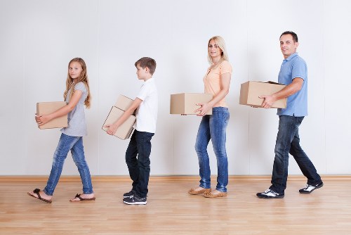 Removal team handling furniture during house removals in Hayes