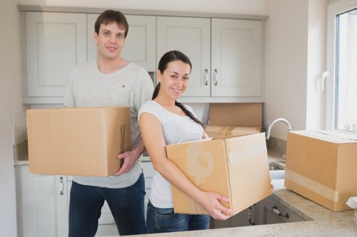 Moving furniture through a narrow flat hallway in Hayes